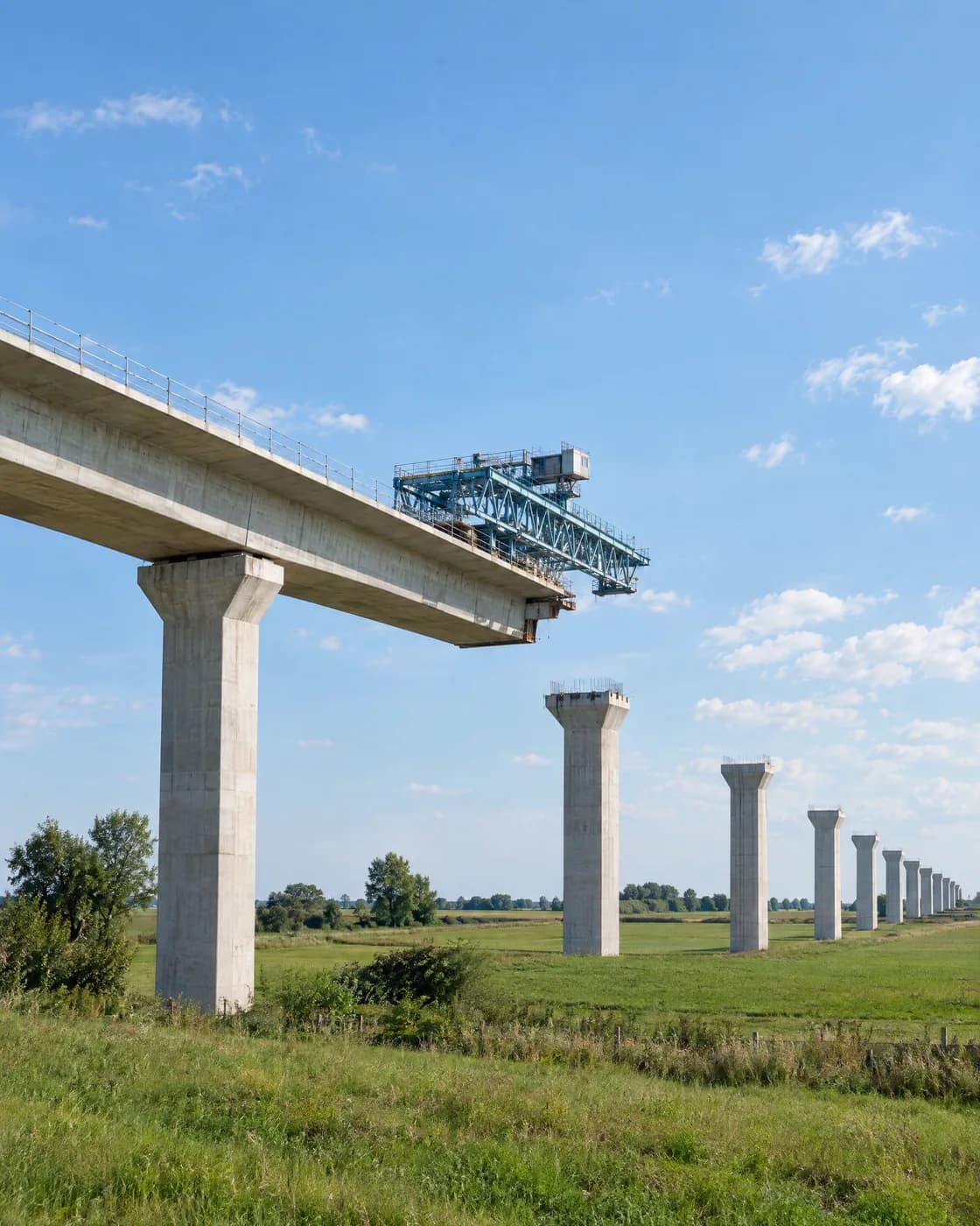 A viaduct under construction that stops in mid-air, with bare piers beyond